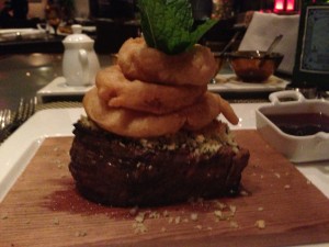 The Wasabi and Ginger Crusted Filet topped with Tempura Onion Rings from Tamarind on Holland America Line's ms Eurodam