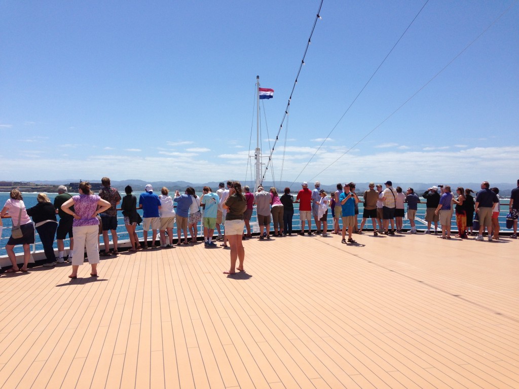 Passengers on the Holland America Line ship, ms Eurodam, line up on the bow to get a glimpse of Puerto Rico as we enter the harbor.