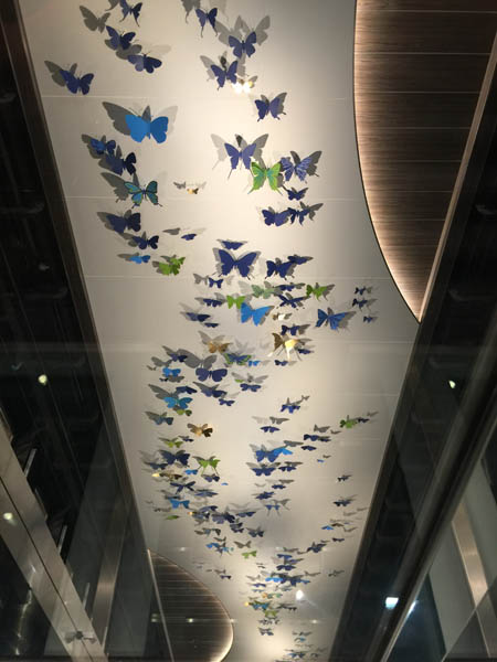 A massive wall of butterflies stretching 10 decks on Quantum of the Seas