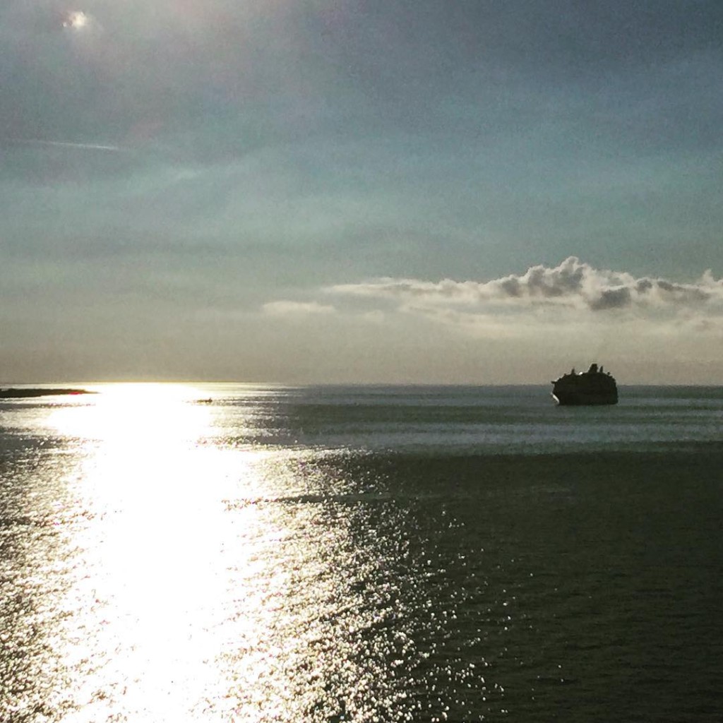 Sunset as the MSC Divina pulls away from Great Stirrup Cay in the Bahamas as a Royal Caribbean ship is still at anchor nearby