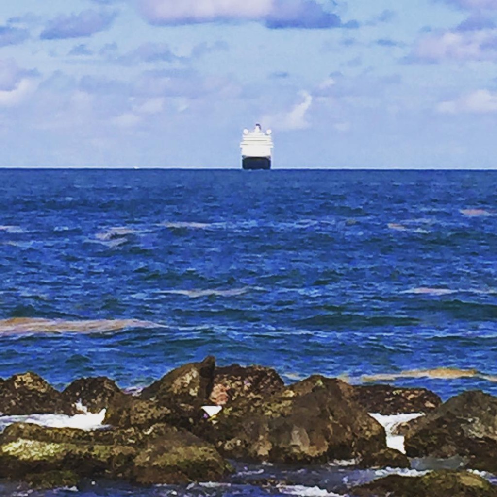 Off in the distance, the Holland America Line ship MS Eurodam makes her way into the San Juan harbor.