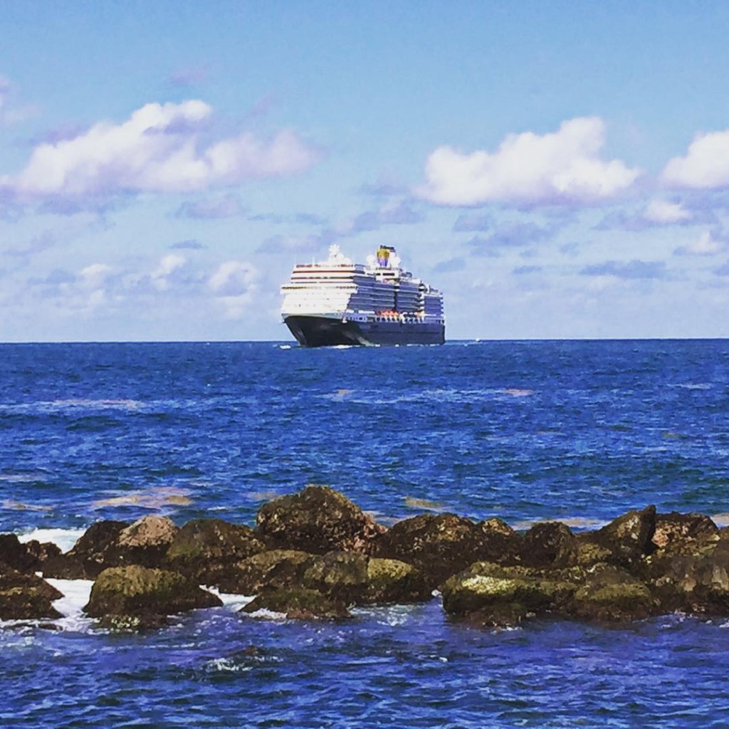 Off in the distance, the Holland America Line ship MS Eurodam makes her way into the San Juan harbor.