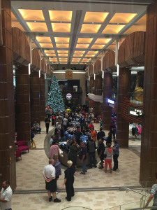 People picking through $10 watches during a sale in the Royal Esplanade on Quantum of the Seas