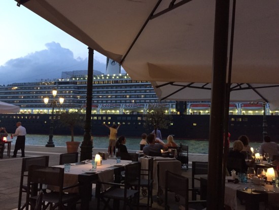 The Holland America Line cruise ship ms Nieuw Amsterdam sails the Giudecca Canal by the Hilton Molino Stucky in Venice Italy on July 27, 2015. Photo credit: Idan Rotem.