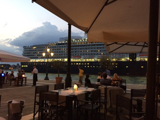 The Holland America Line cruise ship ms Nieuw Amsterdam sails the Giudecca Canal by the Hilton Molino Stucky in Venice Italy on July 27, 2015. Photo credit: Idan Rotem.