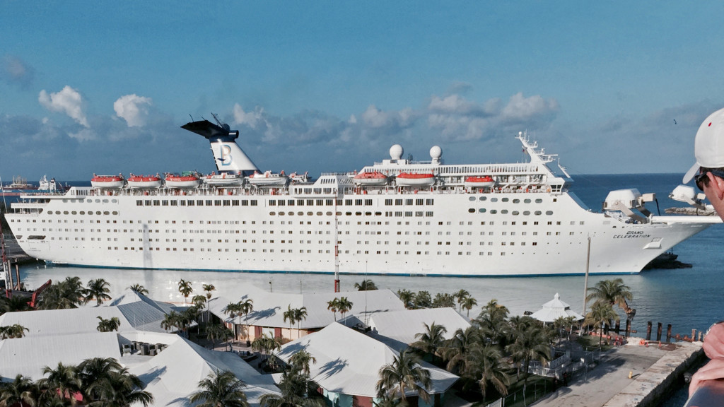 Cruise ship Grand Celebration docked in Freeport, the Bahamas. Viewed from the deck of the Carnival Fantasy.  Photo credit: Arnold Reinhold used with creative commons license.