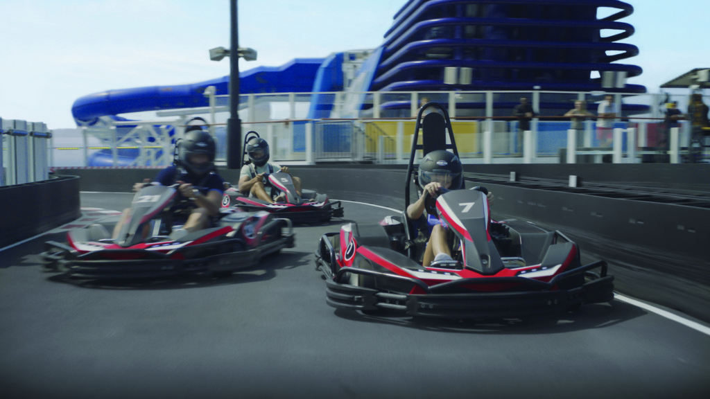 Electric go-karts zip around the track on Norwegian Cruse Line's newest ship, Norwegian Bliss