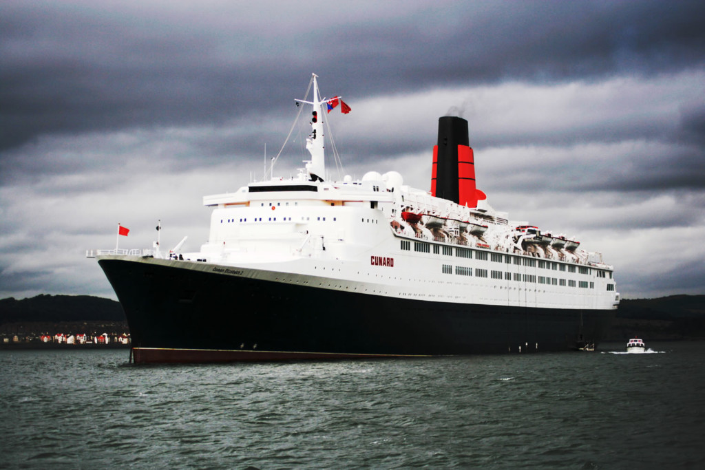 The Cunard Liner RMS Queen Elizabeth 2 anchored off South Queensferry on its last tour round the UK. Photo credit: Tim Dyer creative commons license.