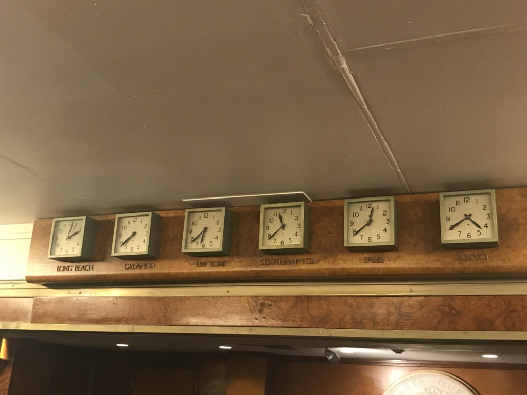 Clocks above the front desk on the Queen Mary