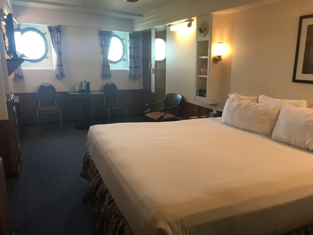 A view of the living area in Stateroom M-033 on the Queen Mary