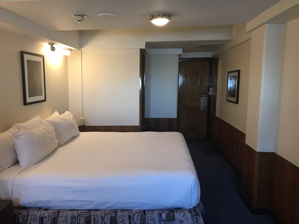 A view of the living area in Stateroom M-033 on the Queen Mary