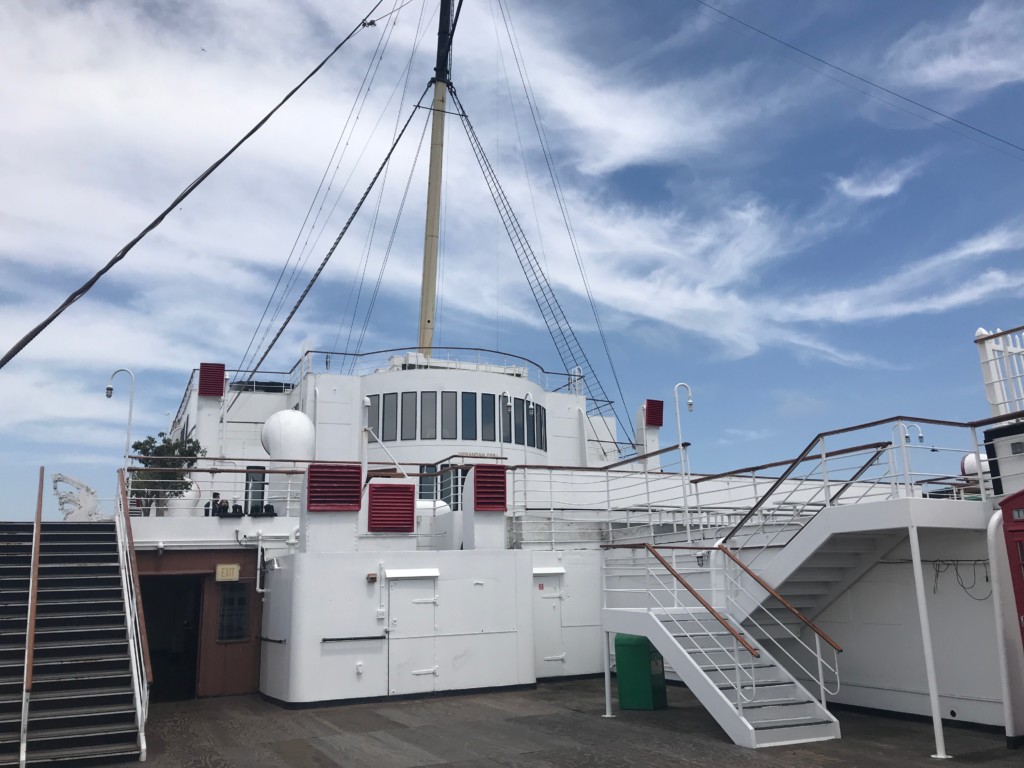 A view of the windows of one of the ship's restaurants, the Verandah Grill, from the stern of the Queen Mary