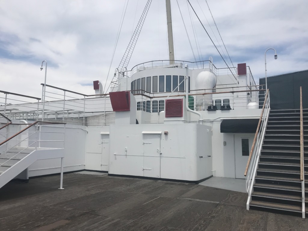 A view of the windows of one of the ship's restaurants, the Verandah Grill, from the stern of the Queen Mary