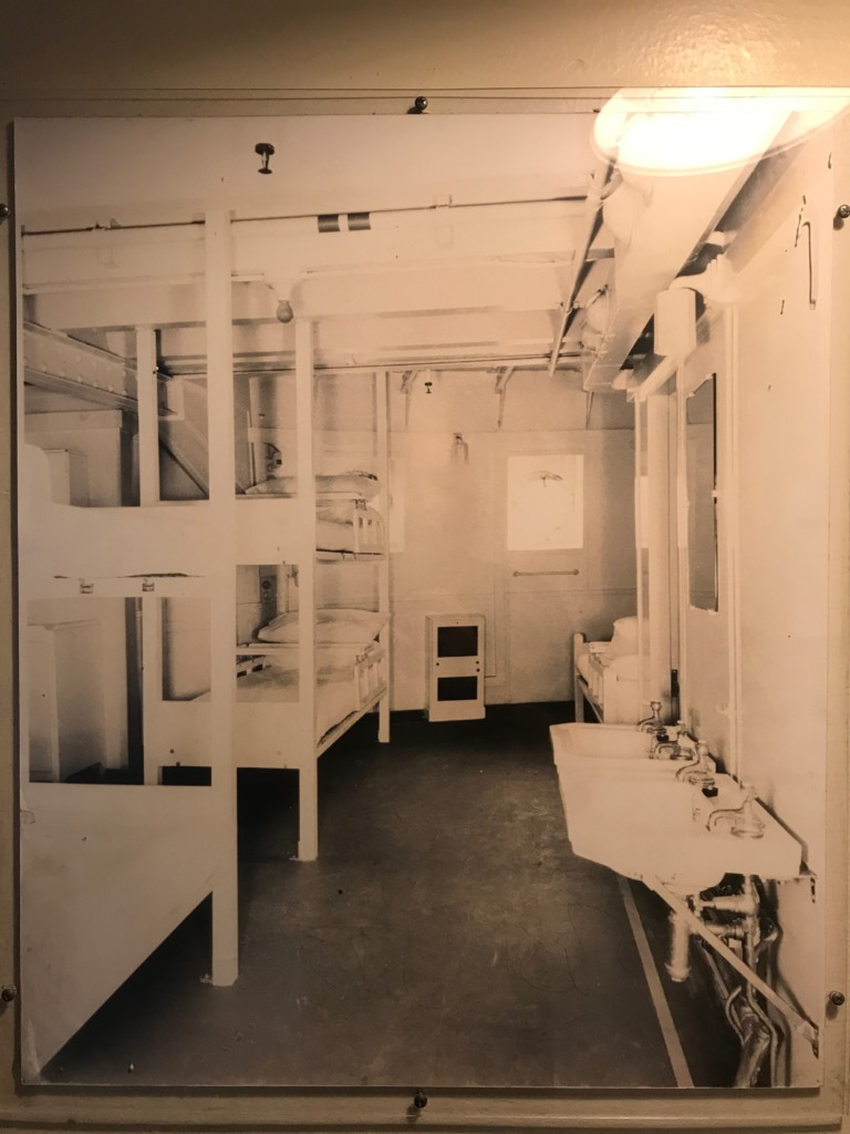 A historical photo shows the layout of the original isolation ward on the Queen Mary