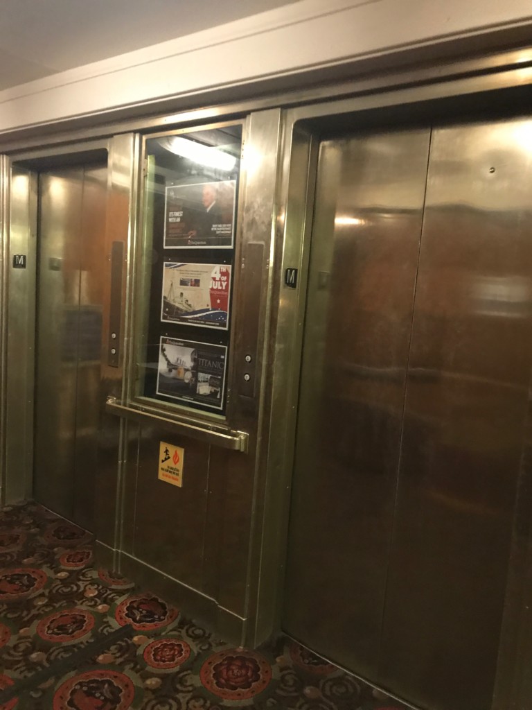 A working bank of passenger elevators on the Queen Mary