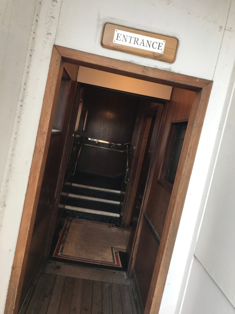 One of the Queen Mary's stairs from the Promenade Deck leading inside