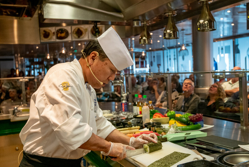 Andy Matsuda hosts a sushi demo for passengers of HAL