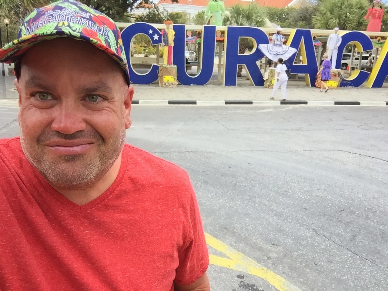 Yours truly stopping for a selfie at the Curacao sign