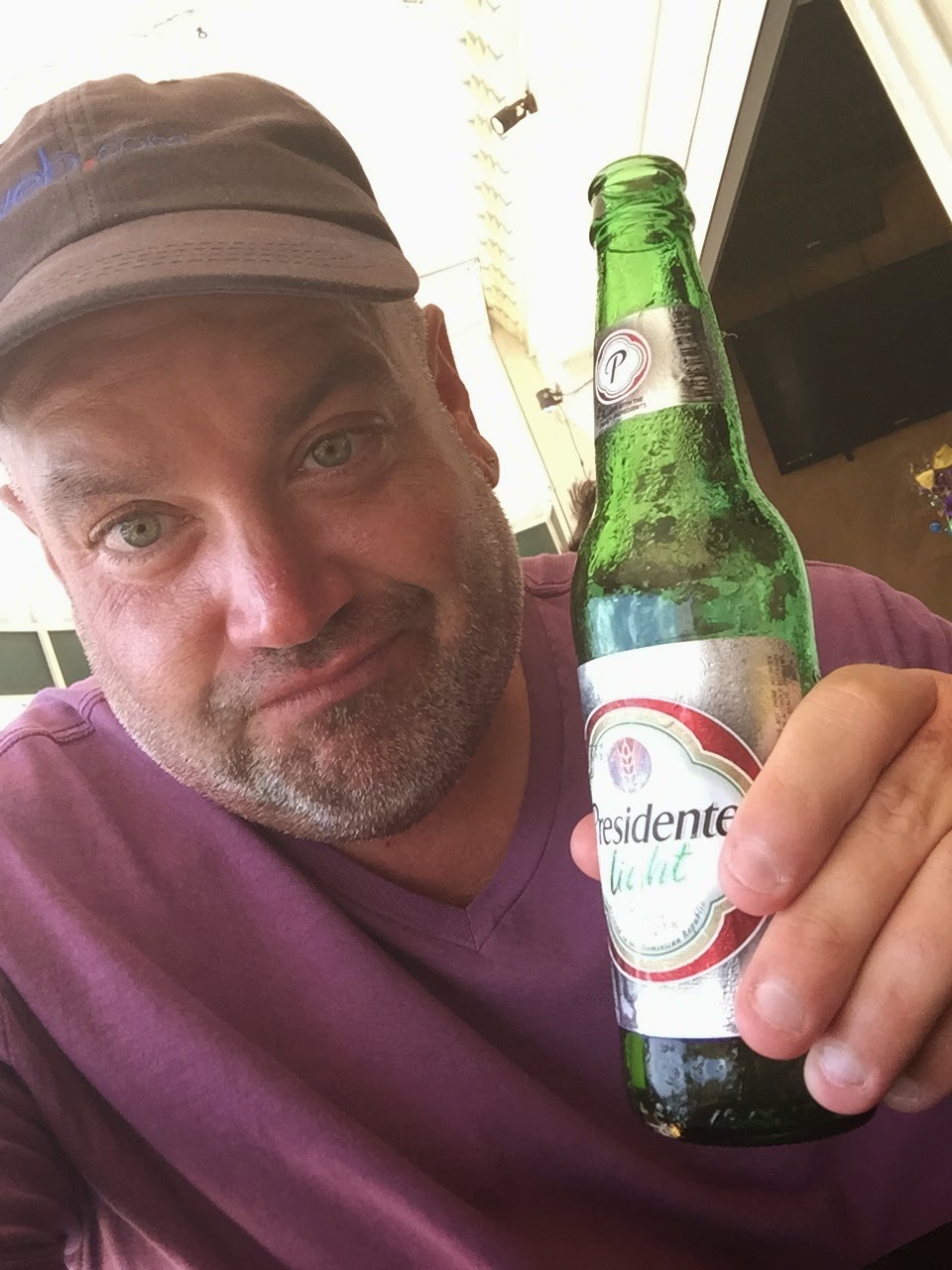 Enjoying a Presidente beer at 7West a restaurant and bar not far from the cruise port in Aruba.