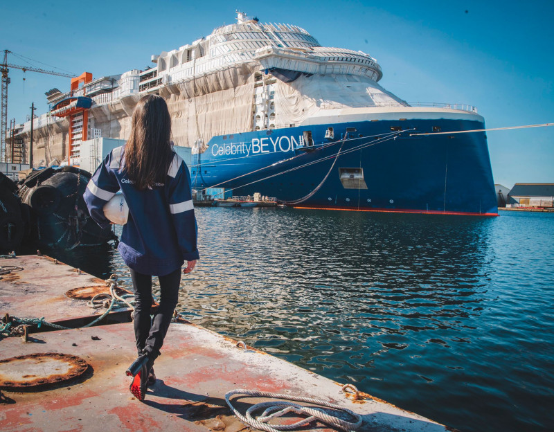 Captain Kate McCue, the first American female cruise ship captain, watches as construction continues on Celebrity Beyond at the Chantiers de l'Atlantique shipyard in Saint-Nazaire, France.