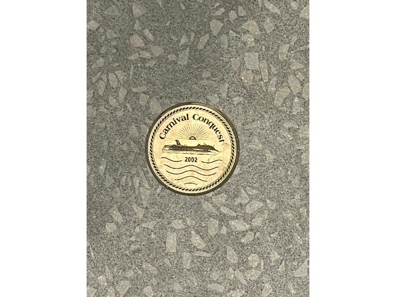 Medallions of Carnival Cruise ships in the floor outside the Golden Jubilee on Carnival Celebration