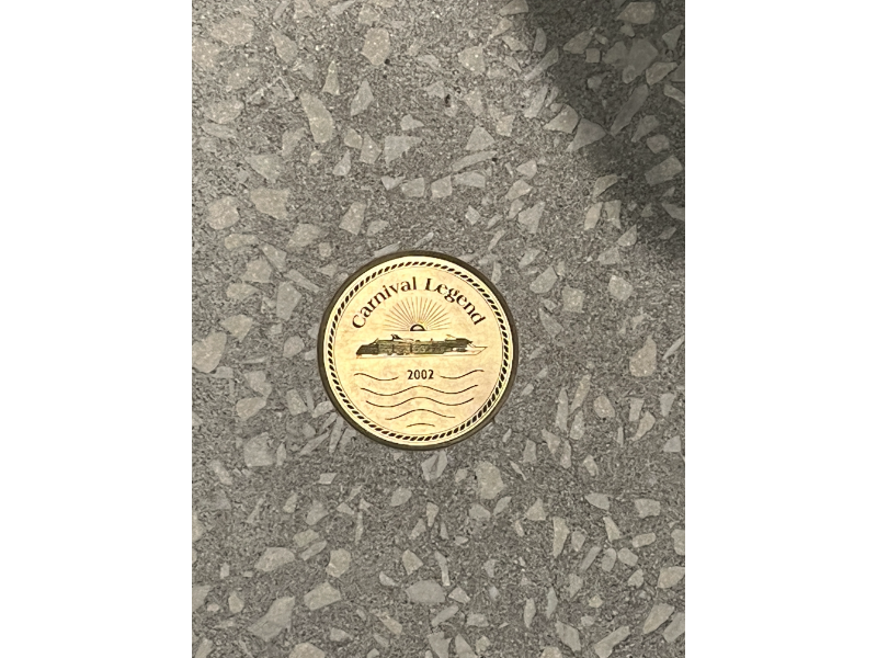 Medallions of Carnival Cruise ships in the floor outside the Golden Jubilee on Carnival Celebration