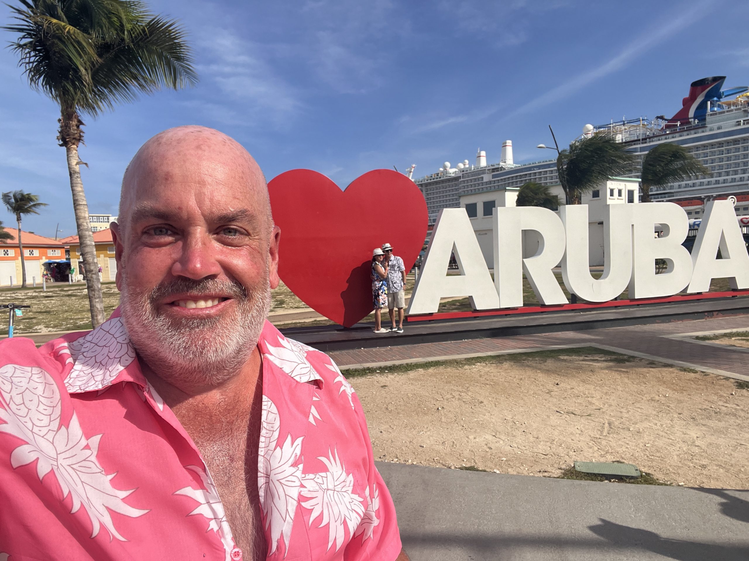 An obligatory selfie next to the I Love Aruba sign