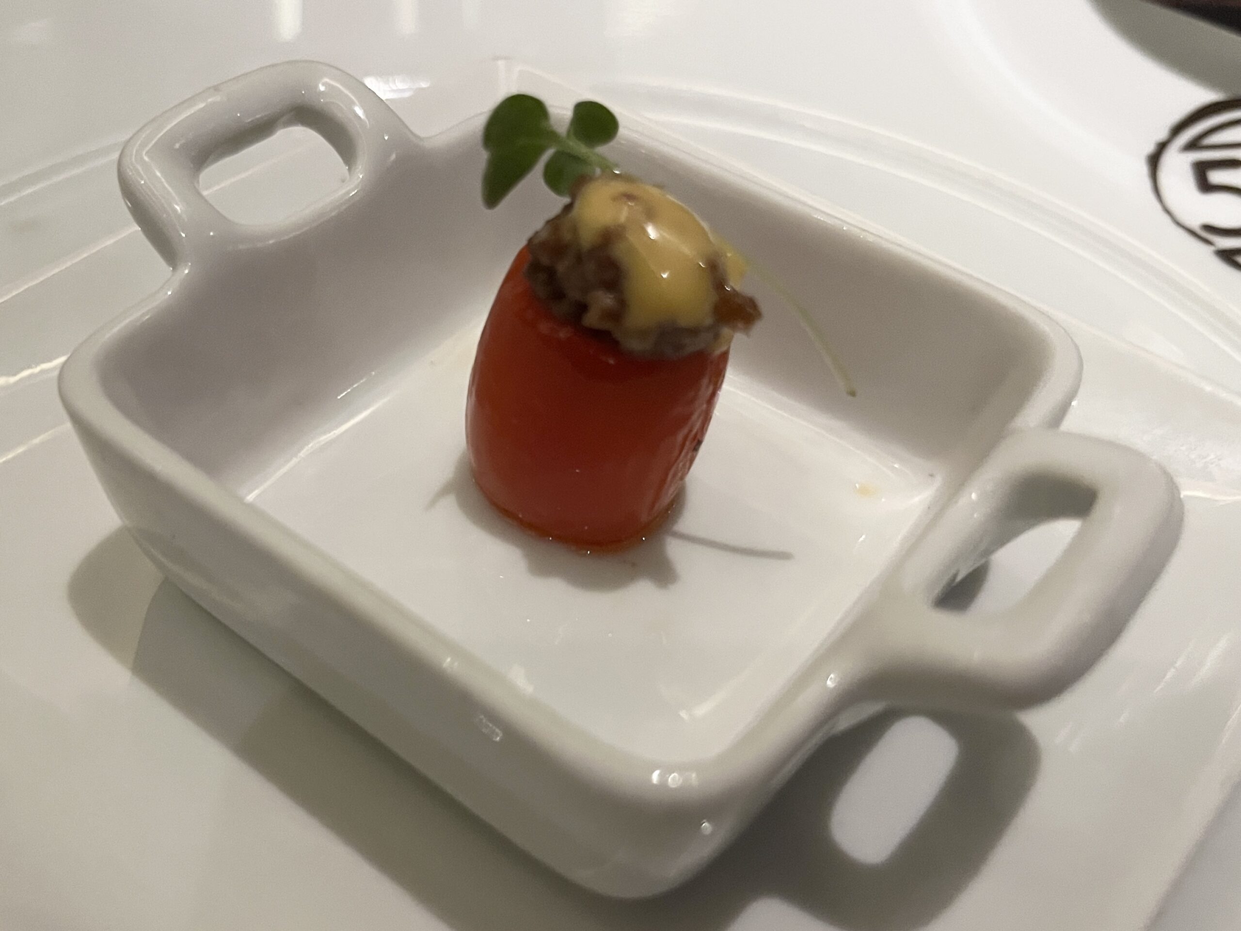 Amuse bouche of a stuffed tomato from Fahrenheit 555 steakhouse on Carnival Horizon