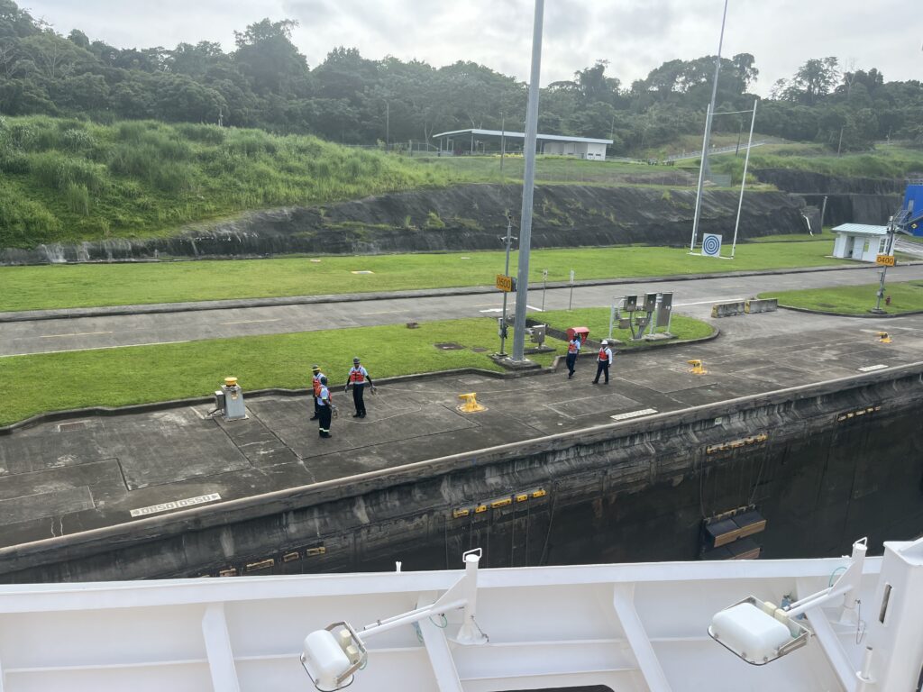 Workers getting ready to tie up the Rotterdam as we enter one of the canal's new locks