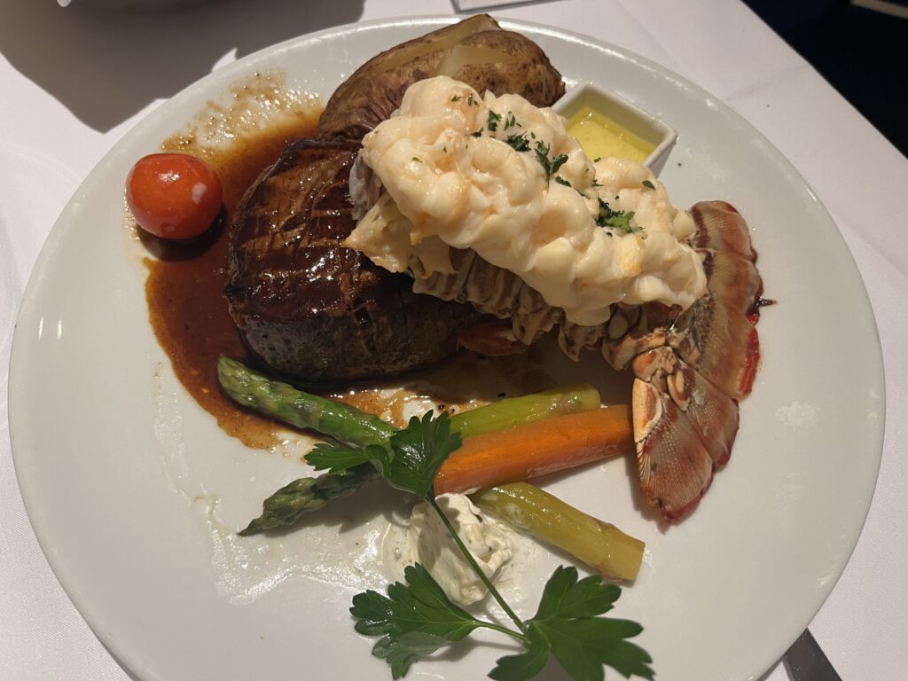 Filet and lobster tail from the Pinnacle Grill served in the main dining room on Holland America's Rotterdam