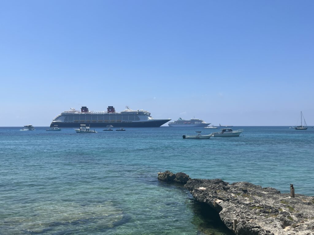 Disney Fantasy and Amira anchored off Grand Cayman