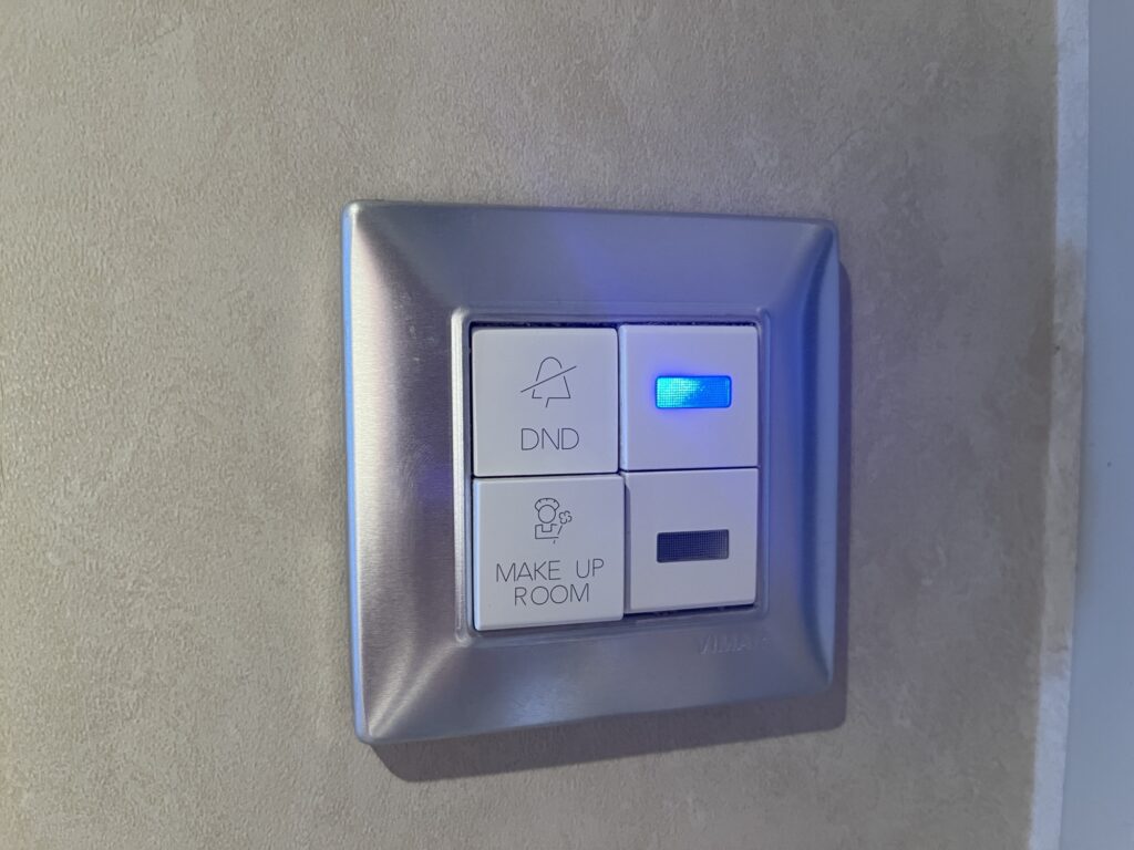 These buttons inside the door are used to alert your stateroom attendant you don't want to be disturbed, or your room is ready to be made up.