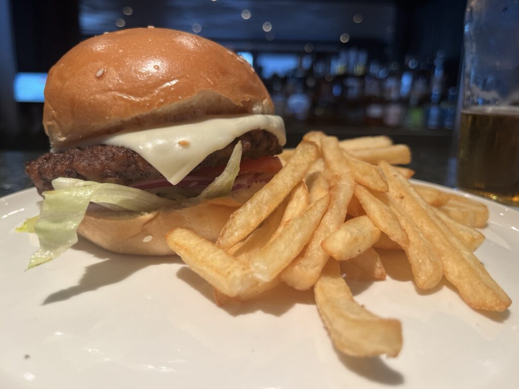 Cheeseburger and fries from The Local on Norwegian Sky