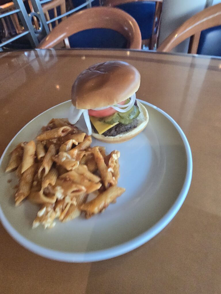 A sad burger and even sadder pasta from the Windjammer on Grandeur of the Seas