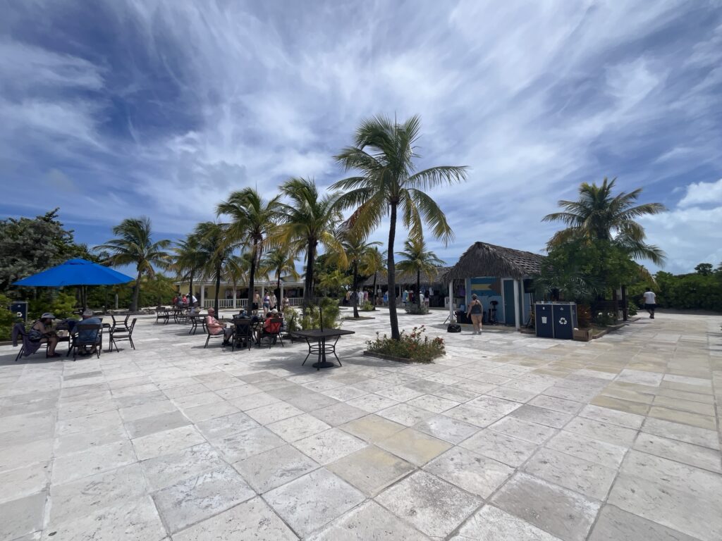 Half Moon Cay entrance plaza with shops and a bar