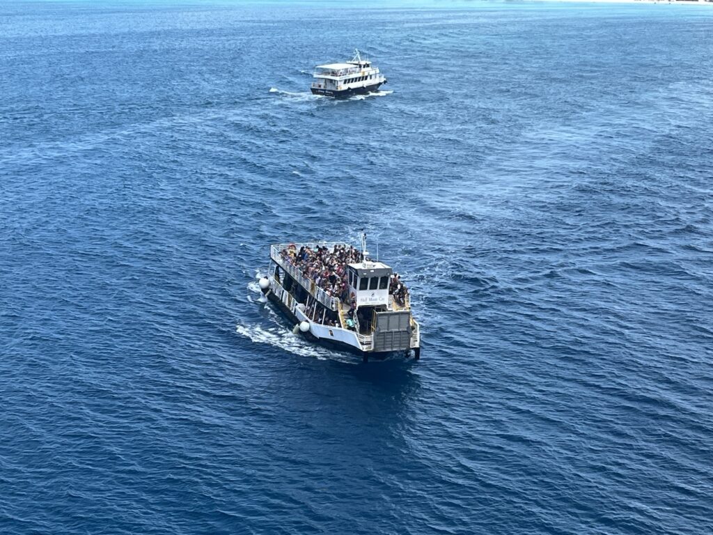 Water shuttles transporting guests to and from Half Moon Cay