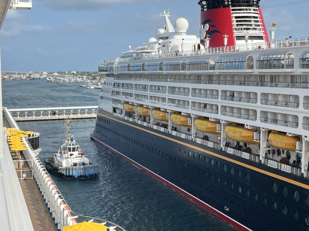 Carnival Vista getting assistance leaving Nassau on September 4, 2024