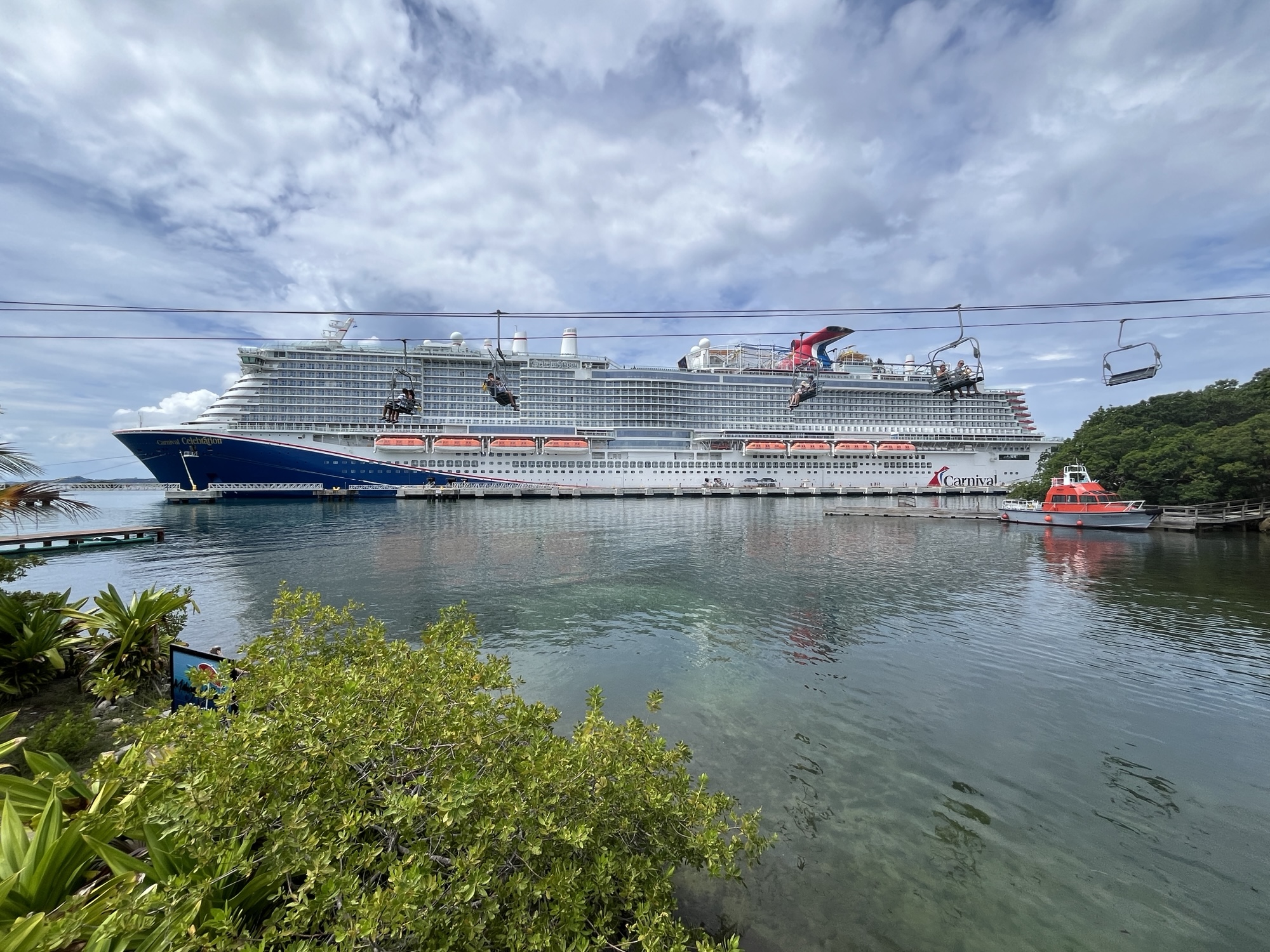 Passengers on the ski lift a Mahogany Bay with Carnival Celebration in the background