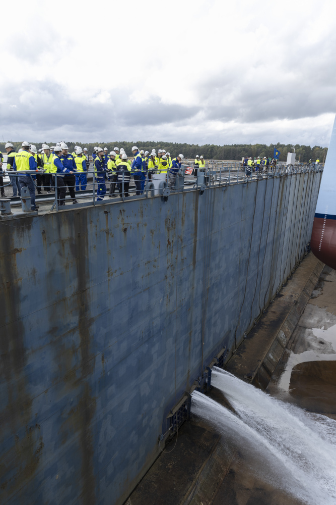 Water begins to fill the drydock as Star of the Seas gets ready to float for the first time.