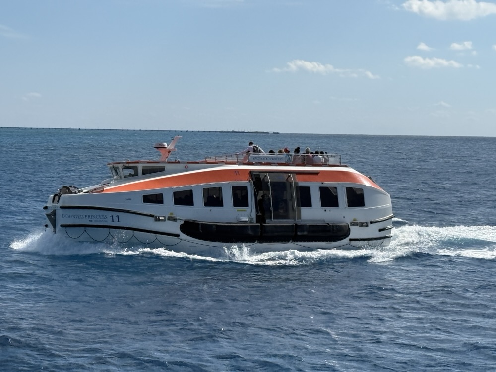 One of the rescue boats from Enchanted Princess being used to tender guests ashore at Princess Cays