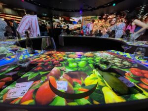 Different designs are projected on the table top and plates during the 360 Expereince