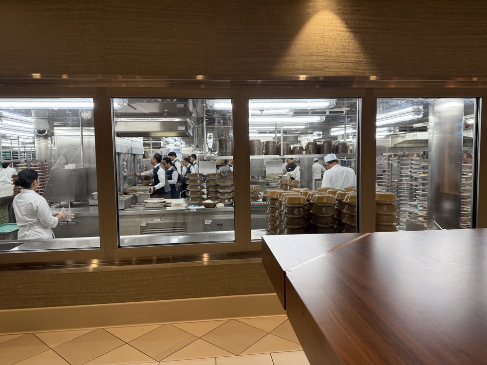 A peek into the galley from The Chef's Table dining room on Carnival Celebration