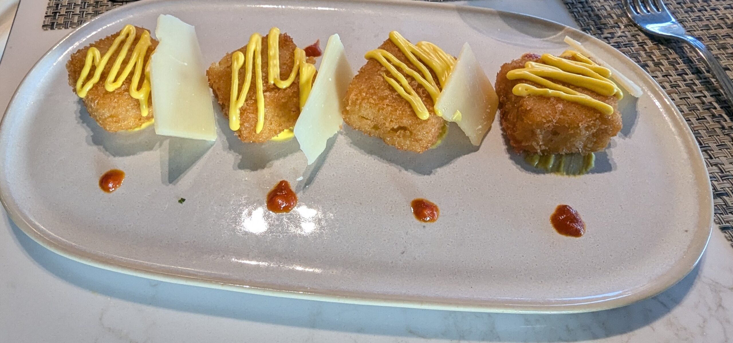 Fried Lobster Polenta Croquettes at La Brasserie on MSC World America
