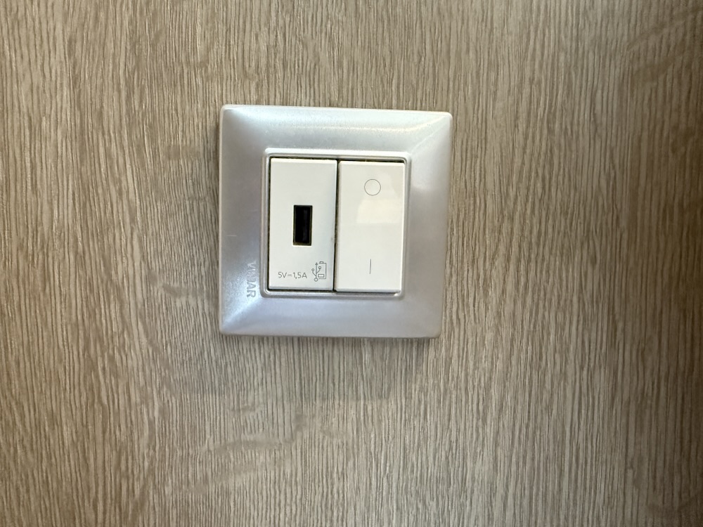 One USB port is near the bed in Stateroom 9254 on MSC Seashore