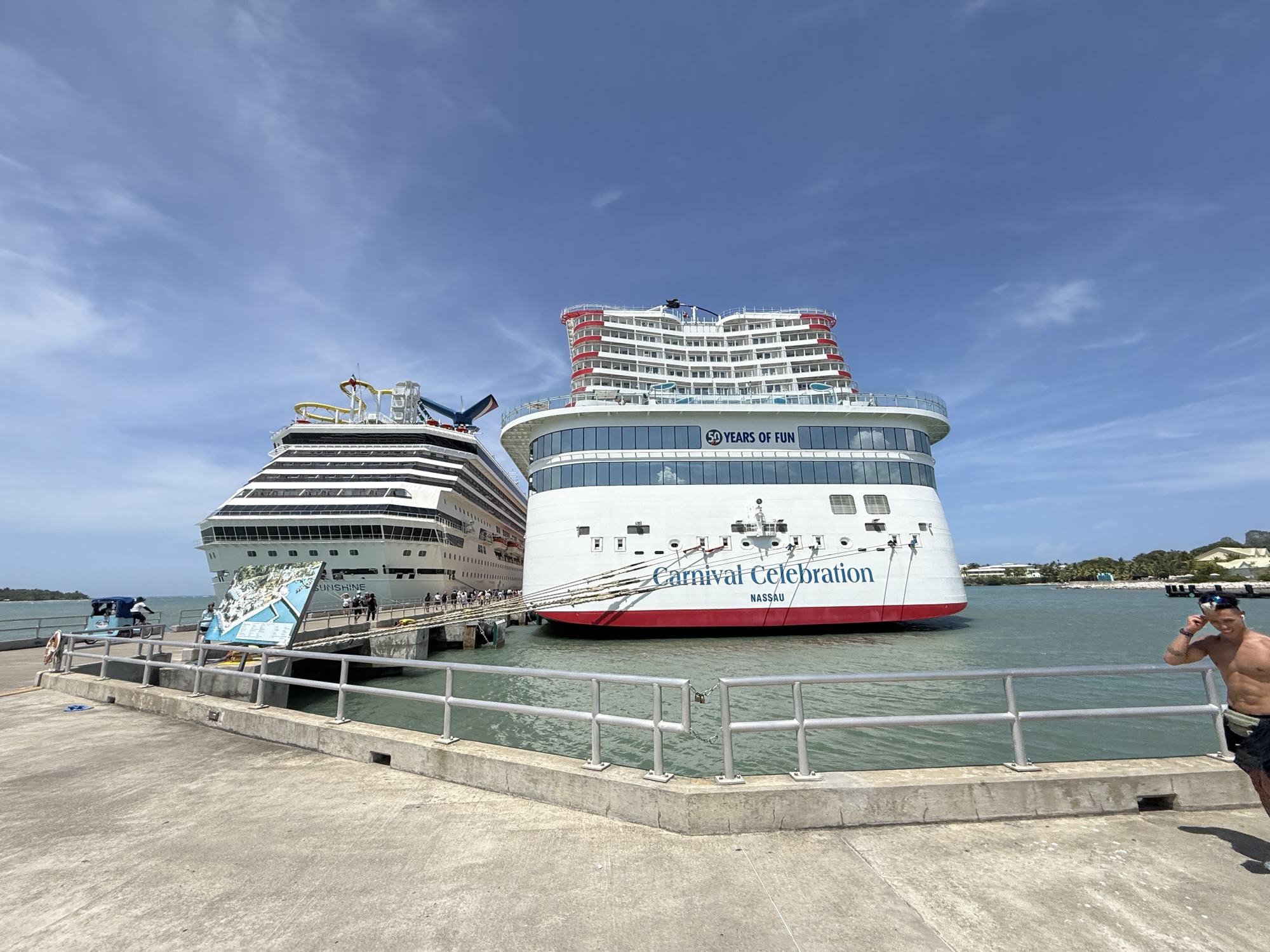 Carnival Sunshine (L) and Carnival Celebration (R) docked at Amber Cove on August 27, 2025