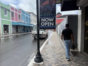 Only in Nassau would they hang banners on poles that end at chest level