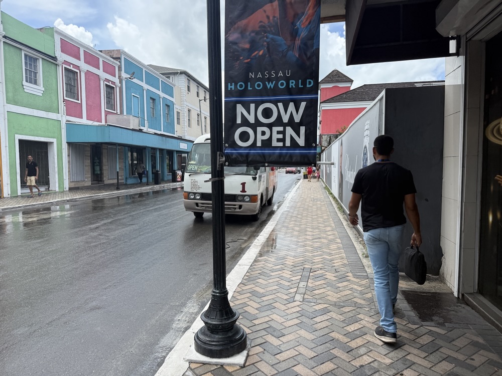 Only in Nassau would they hang banners on poles that end at chest level