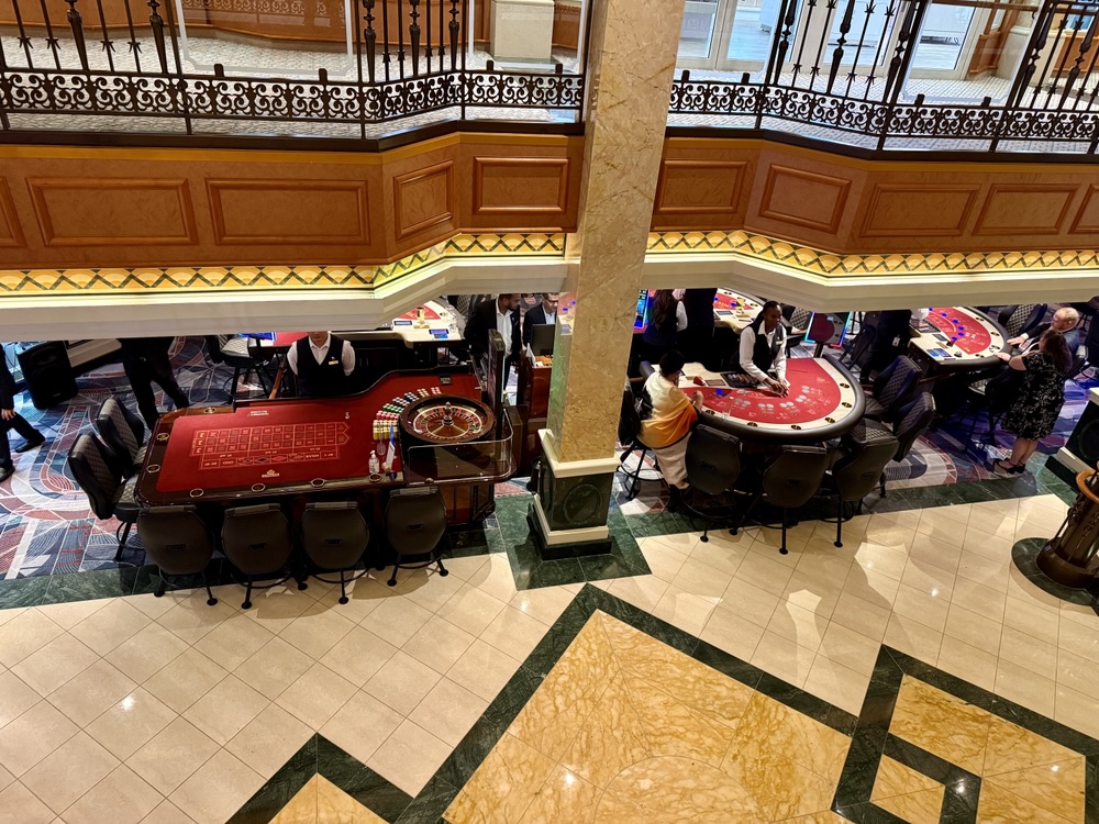 Looking down at empty tables in the casino during the dinner period.