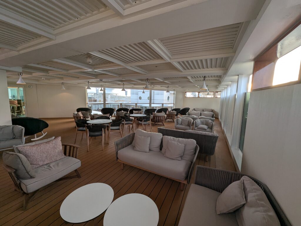 Open air patio the Concierge Lounge on the Disney Magic