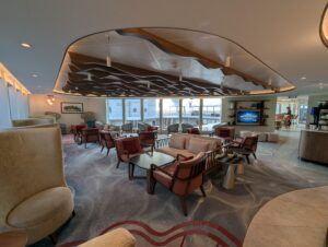 Indoor seating in the Concierge Lounge on the Disney Magic